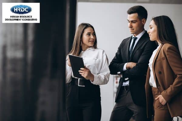 Male And Female Business People Working On Tablet In Office