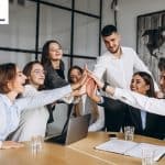 Group Of People Working Out Business Plan In An Office