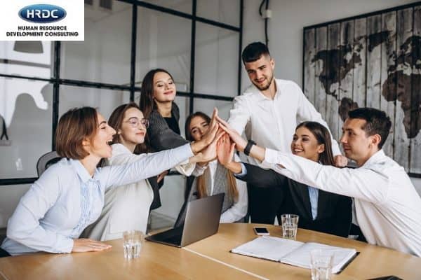 Group Of People Working Out Business Plan In An Office